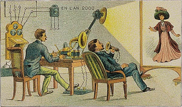 Cartão-postal colorido de 1910: um homem fala por um tubo vendo uma moça numa tela, imaginando o ano 2000